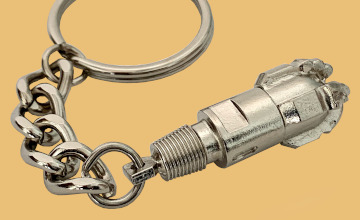 Oilfield drilling crew handout keychain of a pdc bit chrome plated